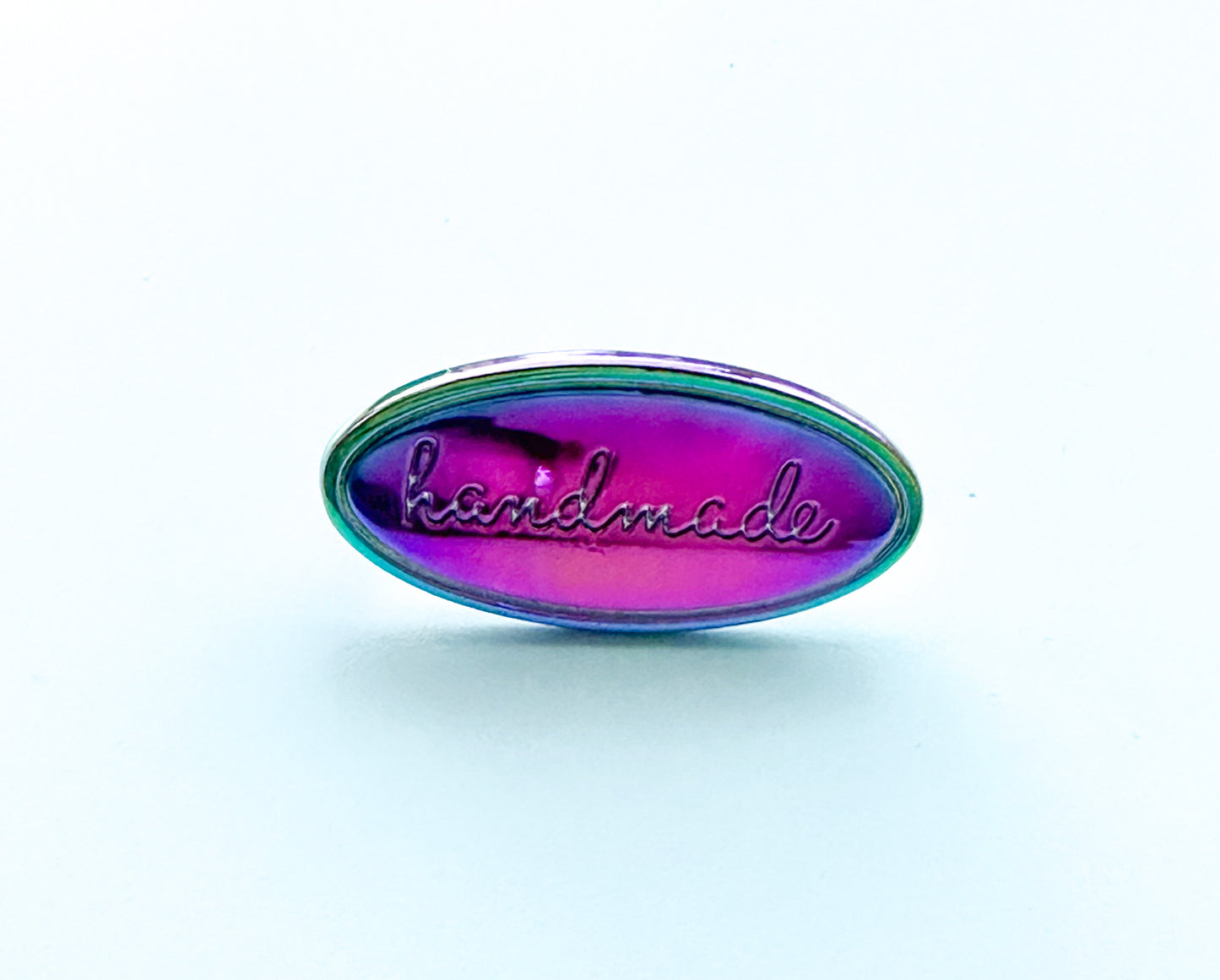 “Handmade” metal oval bag label