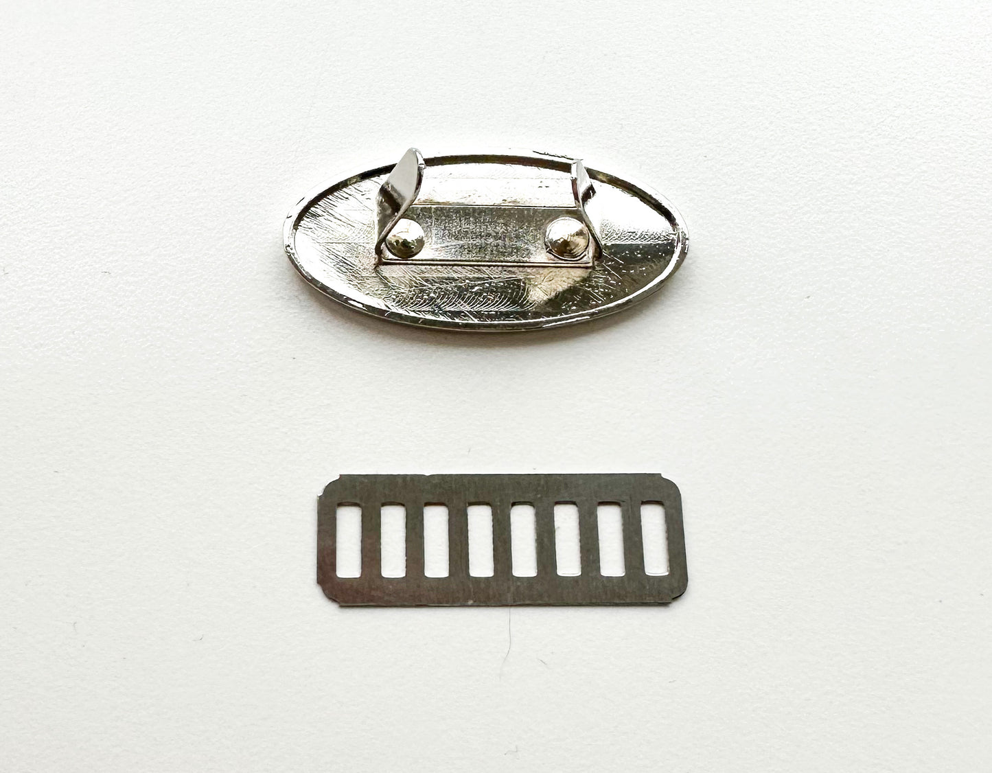 “Handmade” metal oval bag label