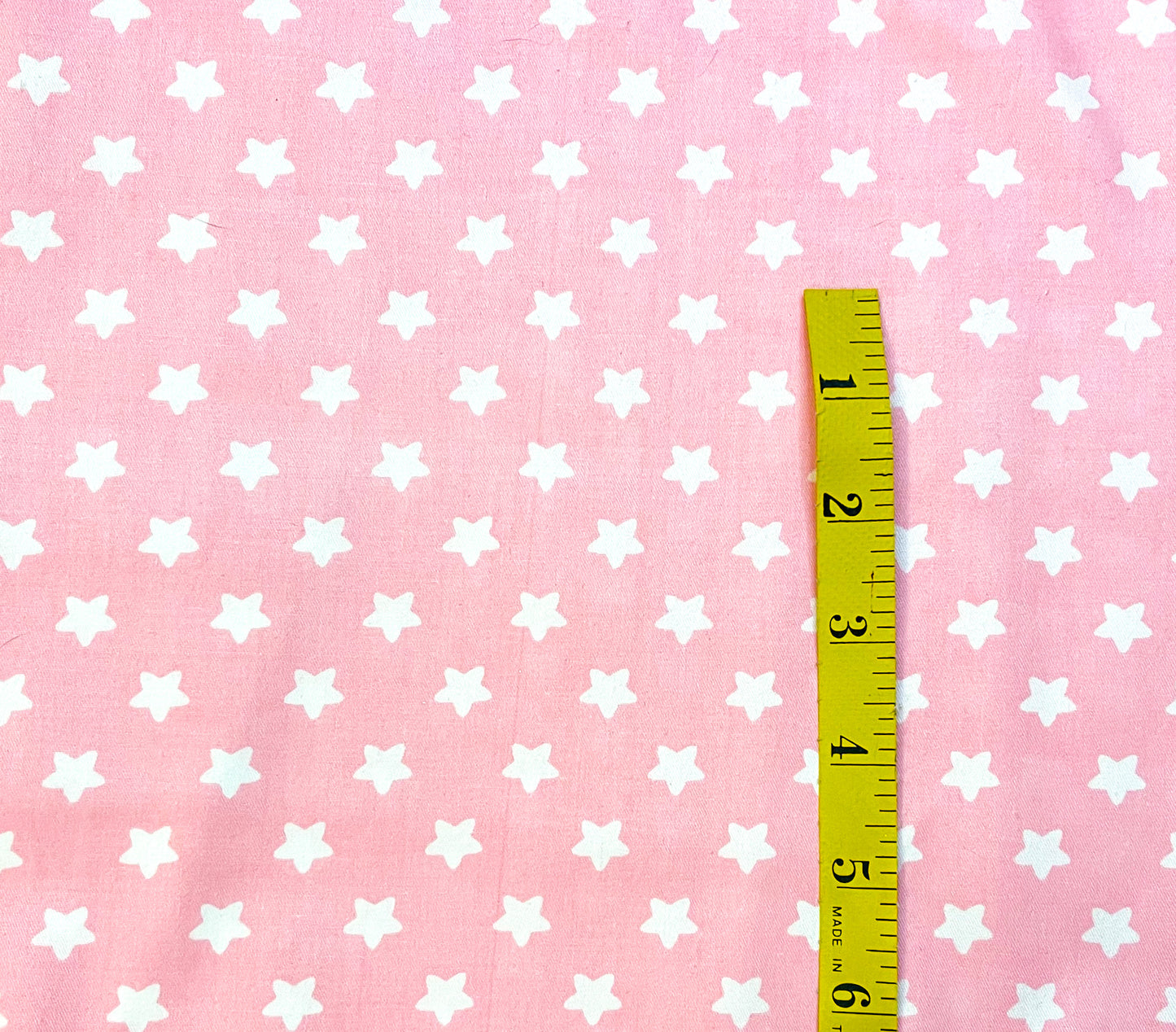 White stars on pink