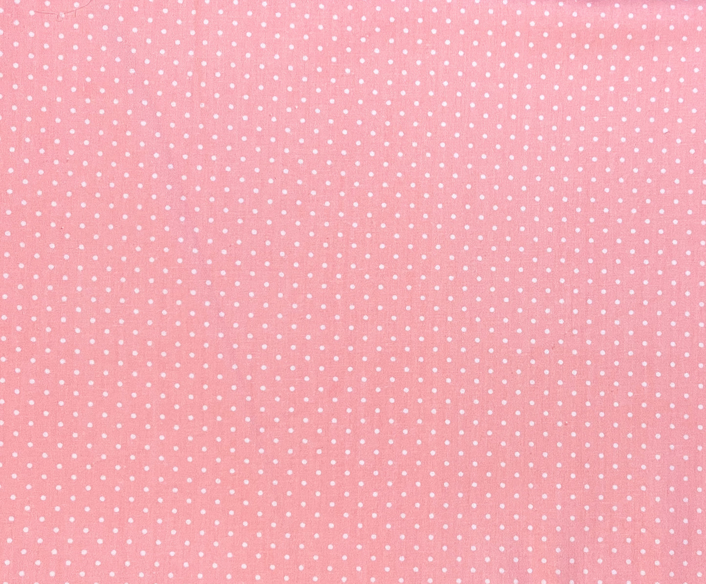 White dots on pale pink