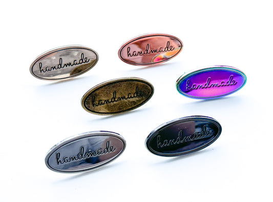 “Handmade” metal oval bag label